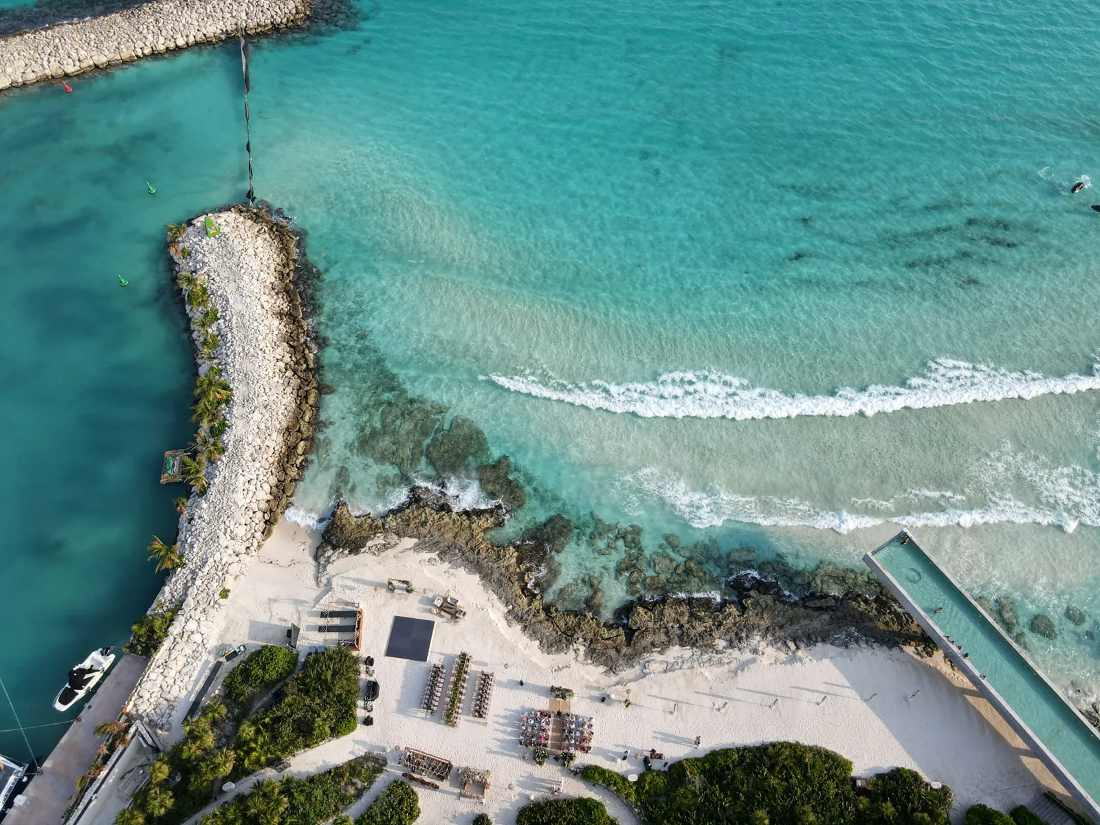 Aerial view of turquoise Caribbean water along the Cancún coastline
